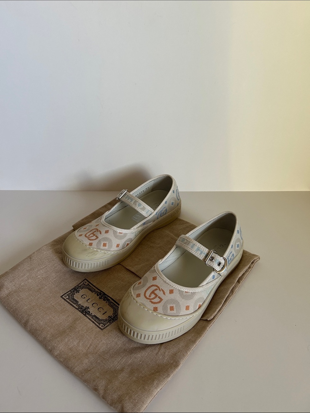 Gucci Ivory Canvas Mary Jane Flats with Pastel Logo Print